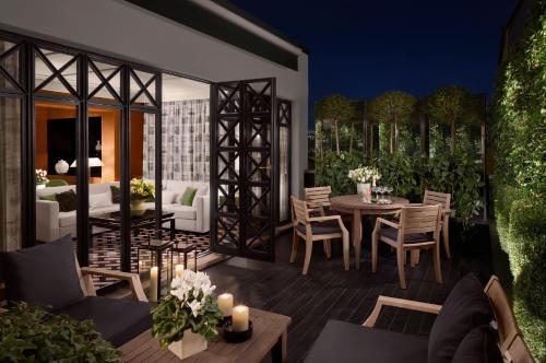 an architectural rendering of a patio with a table and chairs at Four Seasons Hotel Milano in Milan