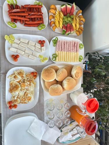 a table filled with different plates of food at LiEl Holiday in Vlorë