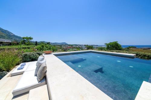a swimming pool in a villa with a view at OraBlu Exclusive Villas in Ischia