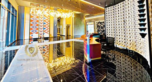 a lobby of a building with a sign on the floor at The Majestic Gen Luxury Suites KLCC in Kuala Lumpur