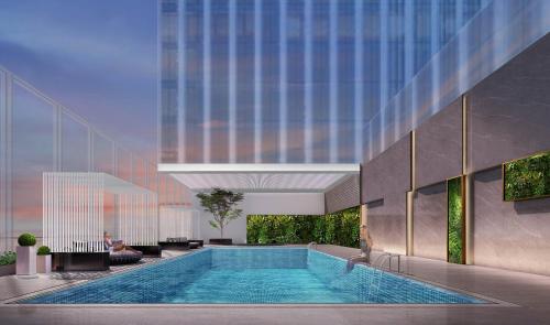 a swimming pool in the middle of a building at Pullman Shenzhen North in Shenzhen