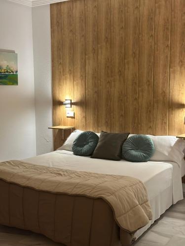 Postel nebo postele na pokoji v ubytování Hospedium Hotel Apartamentos Simón Verde