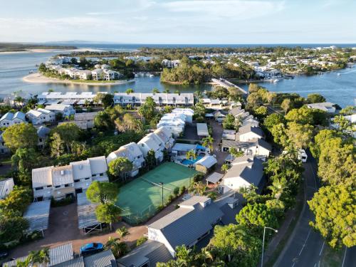 an aerial view of a neighbourhood with a tennis court at Nautilus Noosa Resort in Noosaville