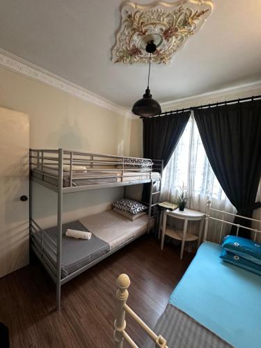 Postel nebo postele na pokoji v ubytování Green Homestay