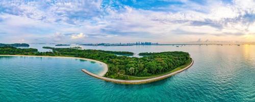 an island in the middle of a large body of water at Tiny Away Escape at Lazarus - 1980 in Singapore