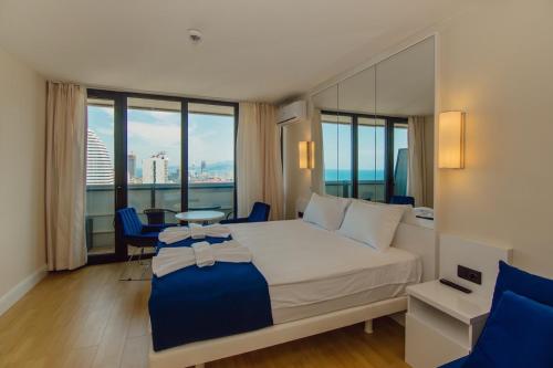 Voodi või voodid majutusasutuse MY SUNSHINE APARTMENTS BATuMI toas