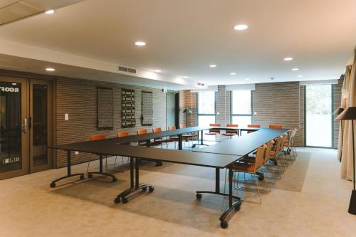a large conference room with a long table and chairs at Bikube Montpellier in Montpellier