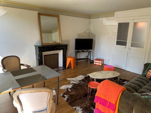 Ein Sitzbereich in der Unterkunft Le Relais de Paulette et Gaston