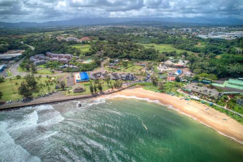 an aerial view of a beach and the ocean at Beachfront Bungalow Walk to Ocean & Restaurants in Lihue