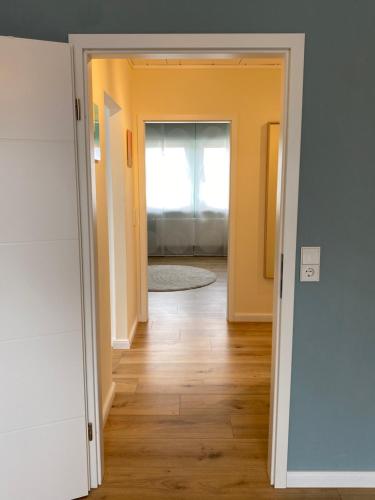 an open door into a room with a hallway at Ferienwohnung Kleine Auszeit in Pulheim