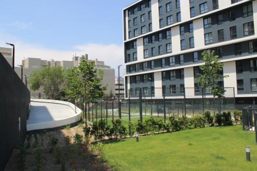 a park in front of a large building at Bext Valdebebas in Madrid