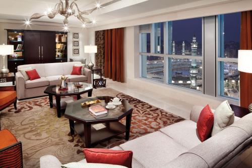 a living room with a couch and a table at Makkah Clock Royal Tower, A Fairmont Hotel in Makkah