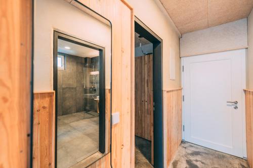 a sliding door in a room with a closet at Möttelin Gut Hügle in Ravensburg