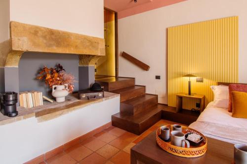 a hotel room with a bed and a fireplace at Tenuta San Pietro a pettine in Santa Maria in Valle
