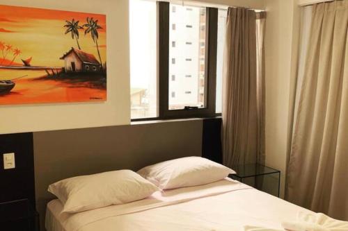 Ένα ή περισσότερα κρεβάτια σε δωμάτιο στο Easy Suites Natal Hotel