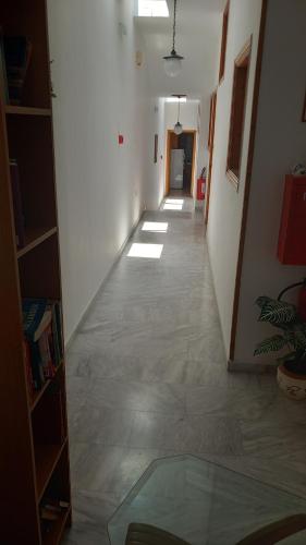 a hallway of a room with a long hallway at Apartments Zafiria in Ágios Konstantínos