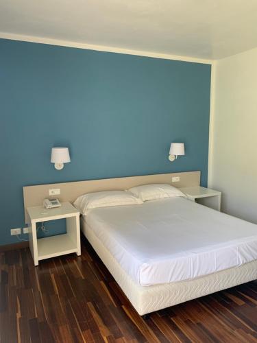 Postel nebo postele na pokoji v ubytování Hotel Ghironi
