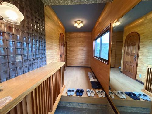 a room with a bunch of shoes on the floor at 鳴門市の貸切一軒家最大10名無料駐車場5台 in Naruto