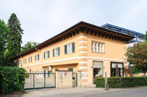 a house with a fence in front of it at Blue flat by GrazRentals best location & free parking in Graz