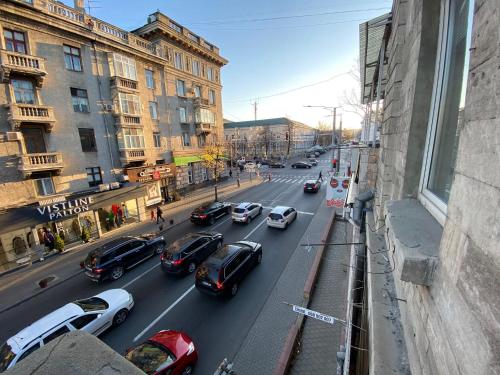 a city street filled with lots of cars at Tourist Home at Stefan cel Mare with 2 rooms in Chişinău