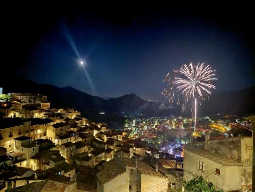 a fireworks display over a city at night at Pollino House in Morano Calabro