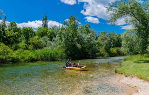 a group of people in a boat on a river at Family Dream Dalmatia - Split by Villas Guide in Košute