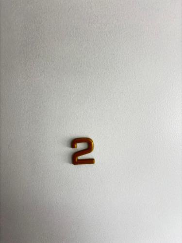 a number is on a white wall at Soh Rent Strasbourg Studio 2 Tv- Wifi Proche Gare in Strasbourg