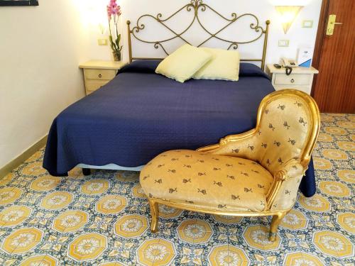 Postel nebo postele na pokoji v ubytování Hotel La Scogliera