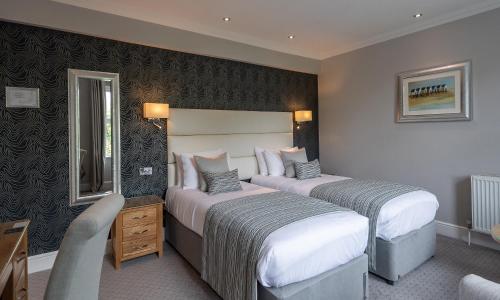 The Carlyon Bay Hotel and Spaにあるベッド