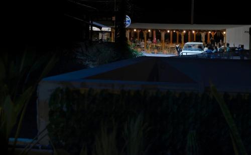 a car parked in front of a building at night at Sidonia Suite in Psari Forada