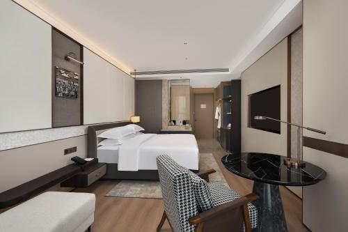 Телевизор и/или развлекательный центр в Wyndham Garden Urumqi Innovation Square