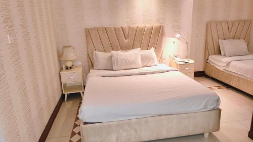 Cama ou camas em um quarto em Sea Shell Palace