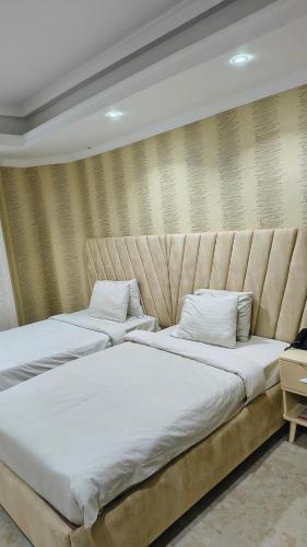 Cama ou camas em um quarto em Sea Shell Palace