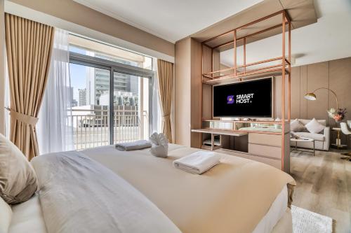 Krevet ili kreveti u jedinici u okviru objekta Exec 1Bed with Balcony&Pool, 10mins to Downtown