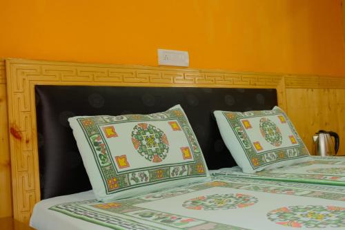 two beds with pillows sitting next to each other at SpitiTara Homestay in Kaza