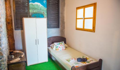 a small room with a small bed and a window at Estate - Villa Discovery in Ljubuški