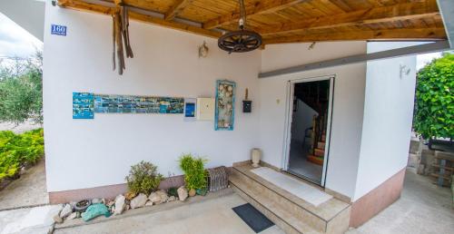 a home with a porch and stairs to a door at Estate - Villa Discovery in Ljubuški