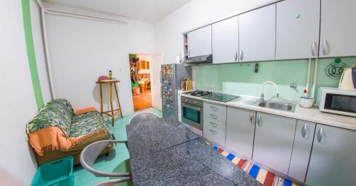 a kitchen with a sink and a microwave at Estate - Villa Discovery in Ljubuški