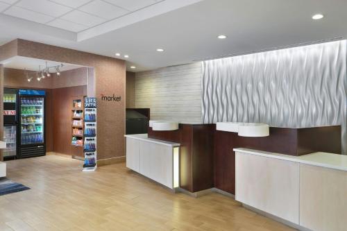 a store lobby with a counter and a pharmacy at Fairfield by Marriott Niagara Falls in Niagara Falls