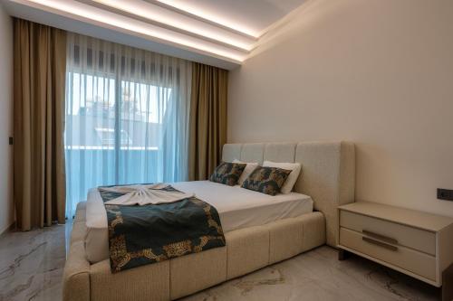 Katil atau katil-katil dalam bilik di Loovox Suites