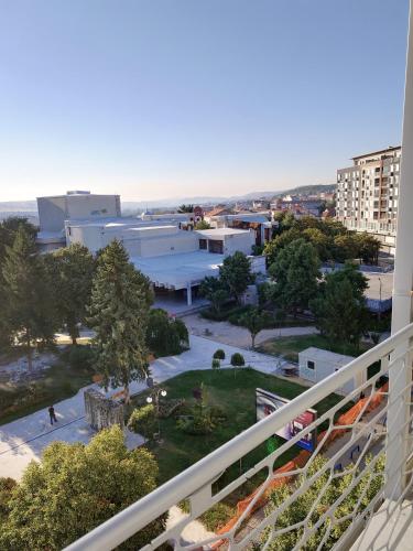 a view of the city from the balcony of a building at M & A Apartmani in Kumanovo