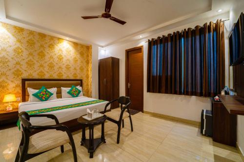 Ein Bett oder Betten in einem Zimmer der Unterkunft Treebo Luxury Stay Premium Inn