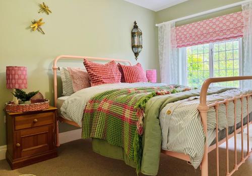 a bedroom with a bed and a window at 5 - Spacious Countryside House for Families & Groups in Pont Sticill