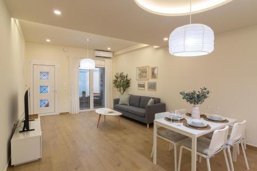 a living room with a table and a couch at Elea in Mytilene