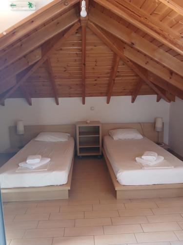 Postel nebo postele na pokoji v ubytování Kritikos Rooms