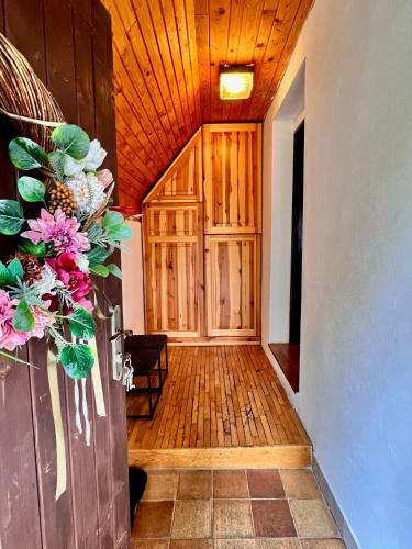 a hallway of a house with a wooden ceiling at Chata Emma Frymburk in Frymburk