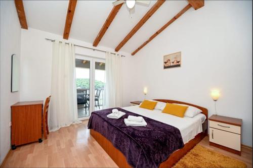Giường trong phòng chung tại Guesthouse Villa Ljubica