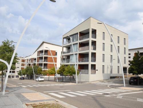 an apartment building on the corner of a street at Cozy apartment to enjoy all year round in Latas