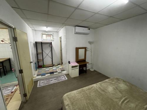 Postel nebo postele na pokoji v ubytování Sukhum Sukhumvit-Onnut Guest House