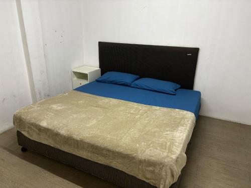 Postel nebo postele na pokoji v ubytování Sukhum Sukhumvit-Onnut Guest House